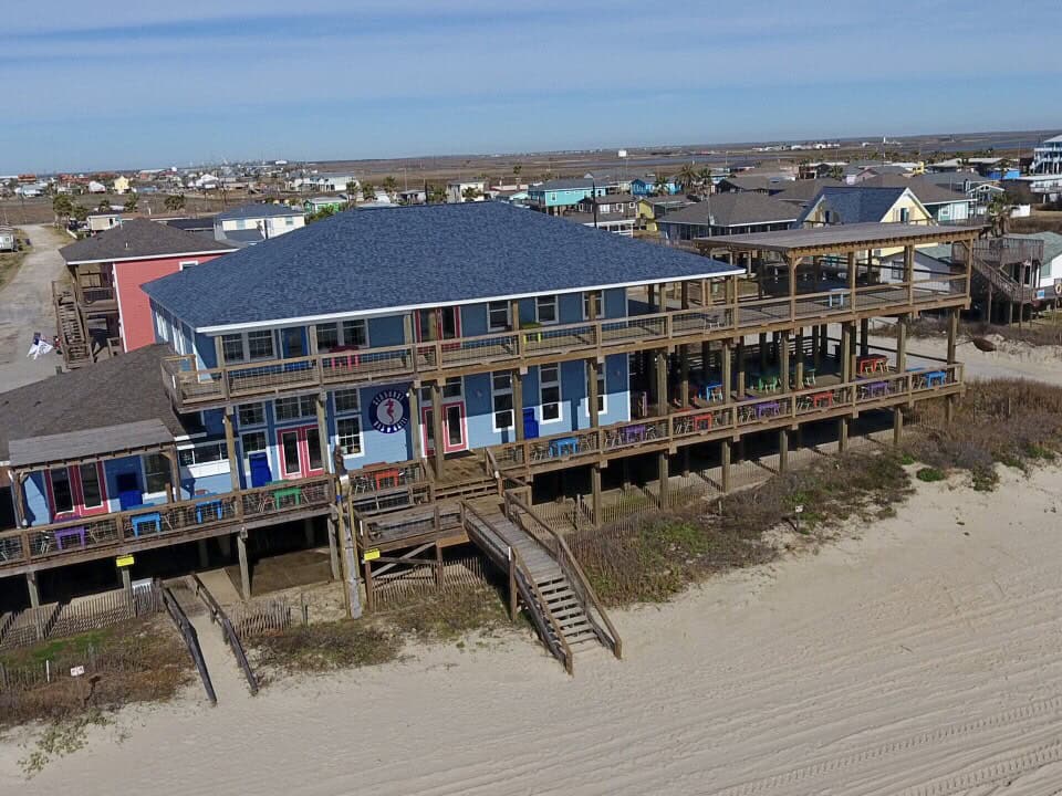 Aerial view of Seahorse Bar & Grill on the beach in Surfside Beach, Texas