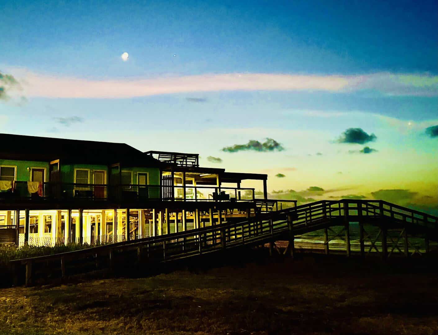 Golden hour over the Gulf and boardwalk at Seahorse Bar & Grill in Surfside Beach
