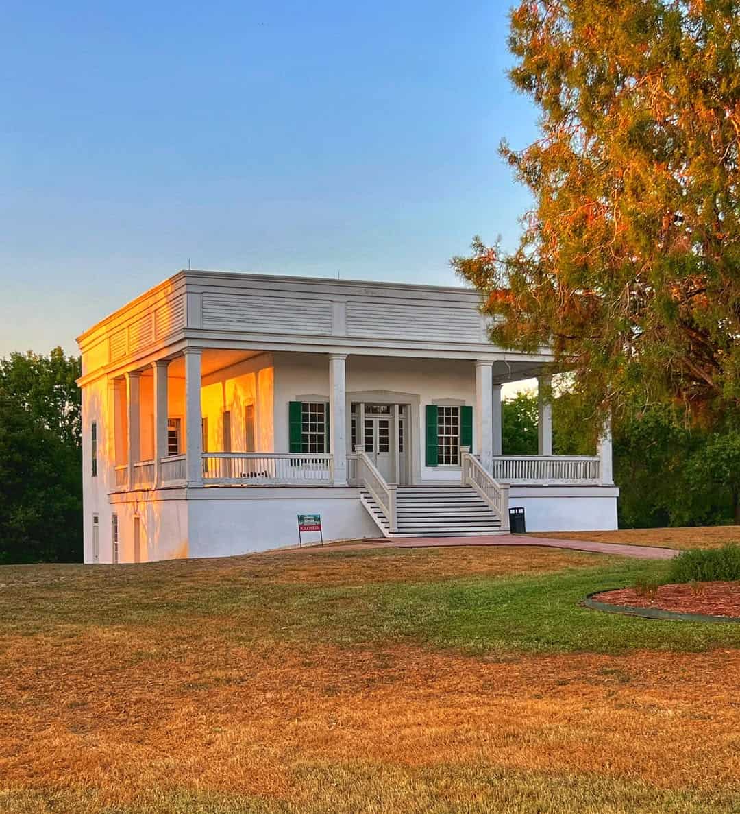 The historic limecrete Sebastopol House at golden hour in Seguin, Texas