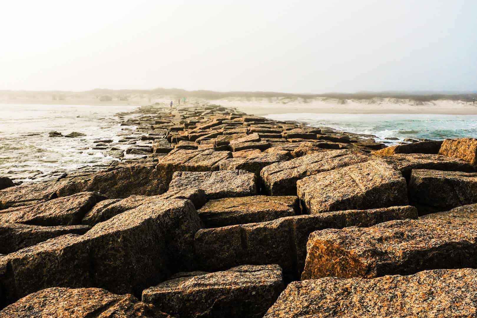 Rock jetty along the shoreline at Mustang Island State Park, Texas