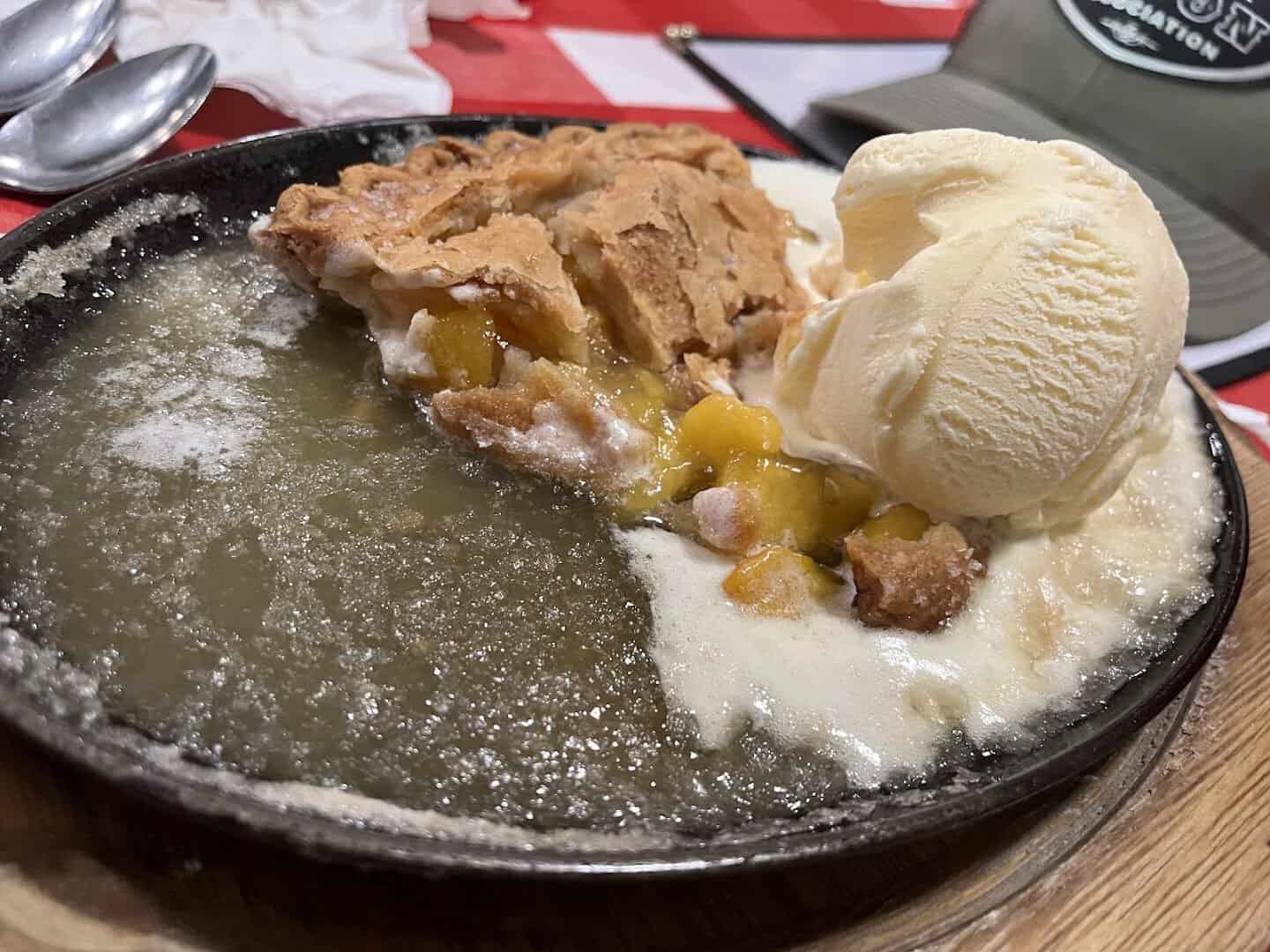 Skillet apple pie topped with a scoop of vanilla ice cream at Texan Cafe and Pie Shop in Hutto, Texas