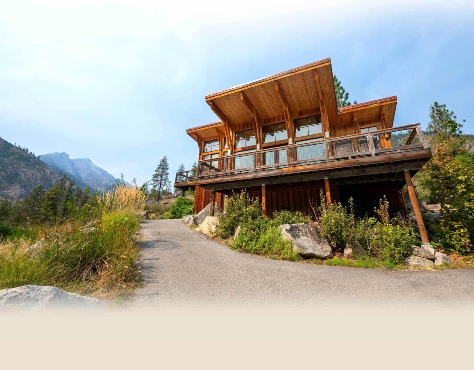 Cabin lodge building along a forest path at Sleeping Lady Mountain Resort in Washington