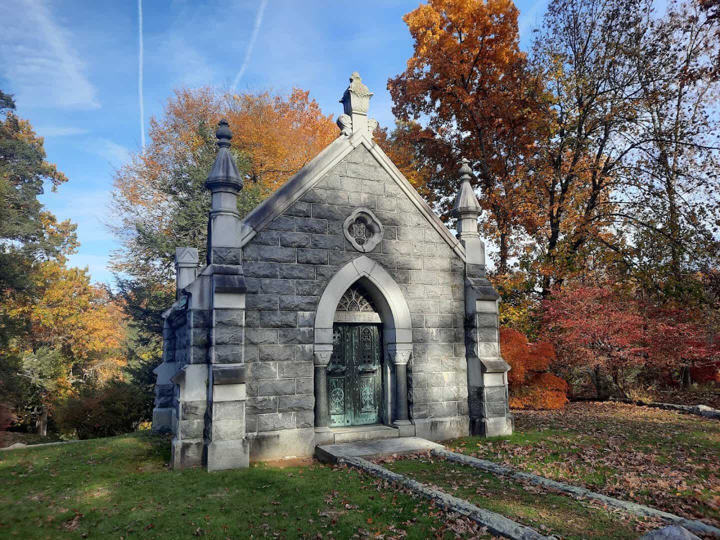 Gothic mausoleum among autumn foliage at Sleepy Hollow Cemetery in Sleepy Hollow, New York