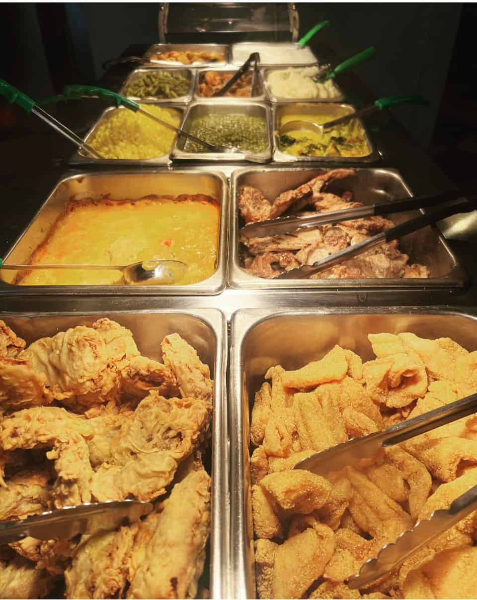 Fried chicken and fried catfish on the buffet at Southern Charm Home Cookin in Corpus Christi, Texas