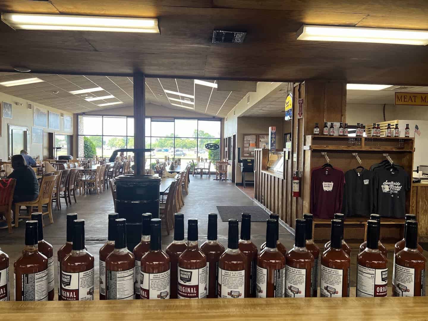 Interior and barbecue sauce bottles at Southside Market and Barbeque in Elgin, Texas