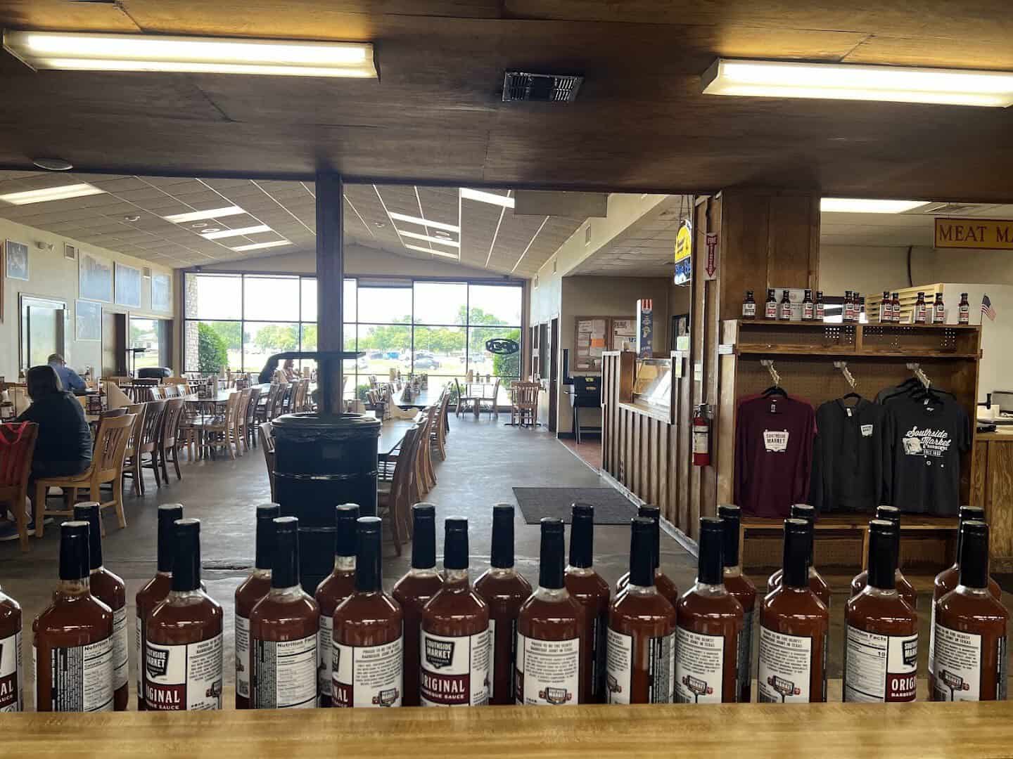 Interior with bottled sauces and retail area at Southside Market and Barbeque in Elgin, Texas
