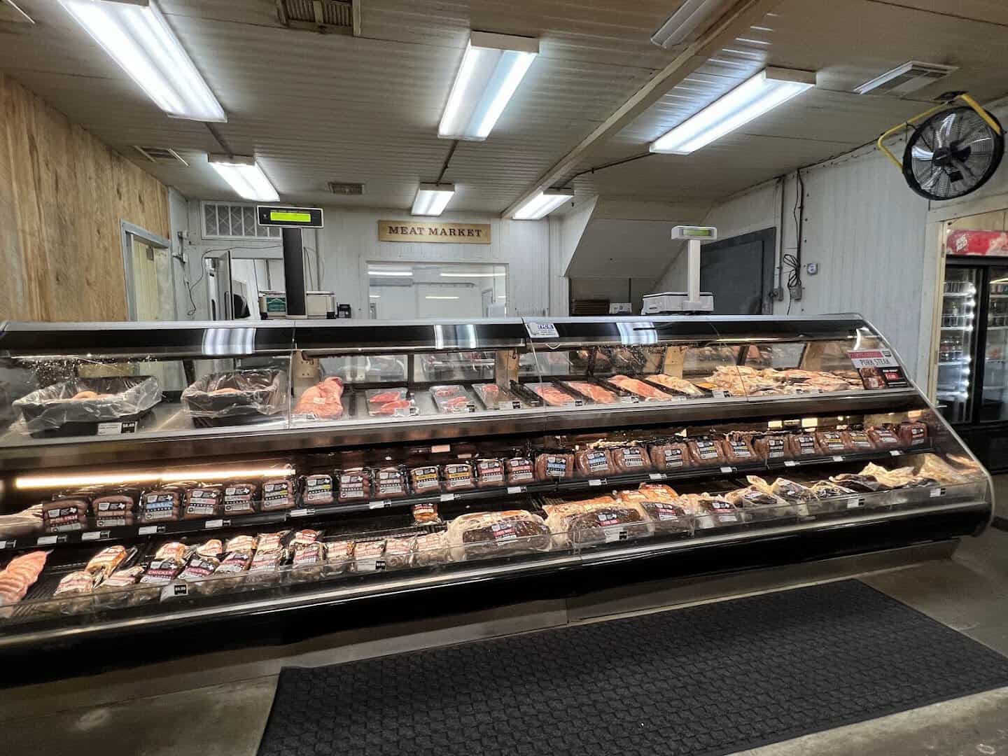 Meat market case with rings of Elgin hot sausage at Southside Market and Barbeque