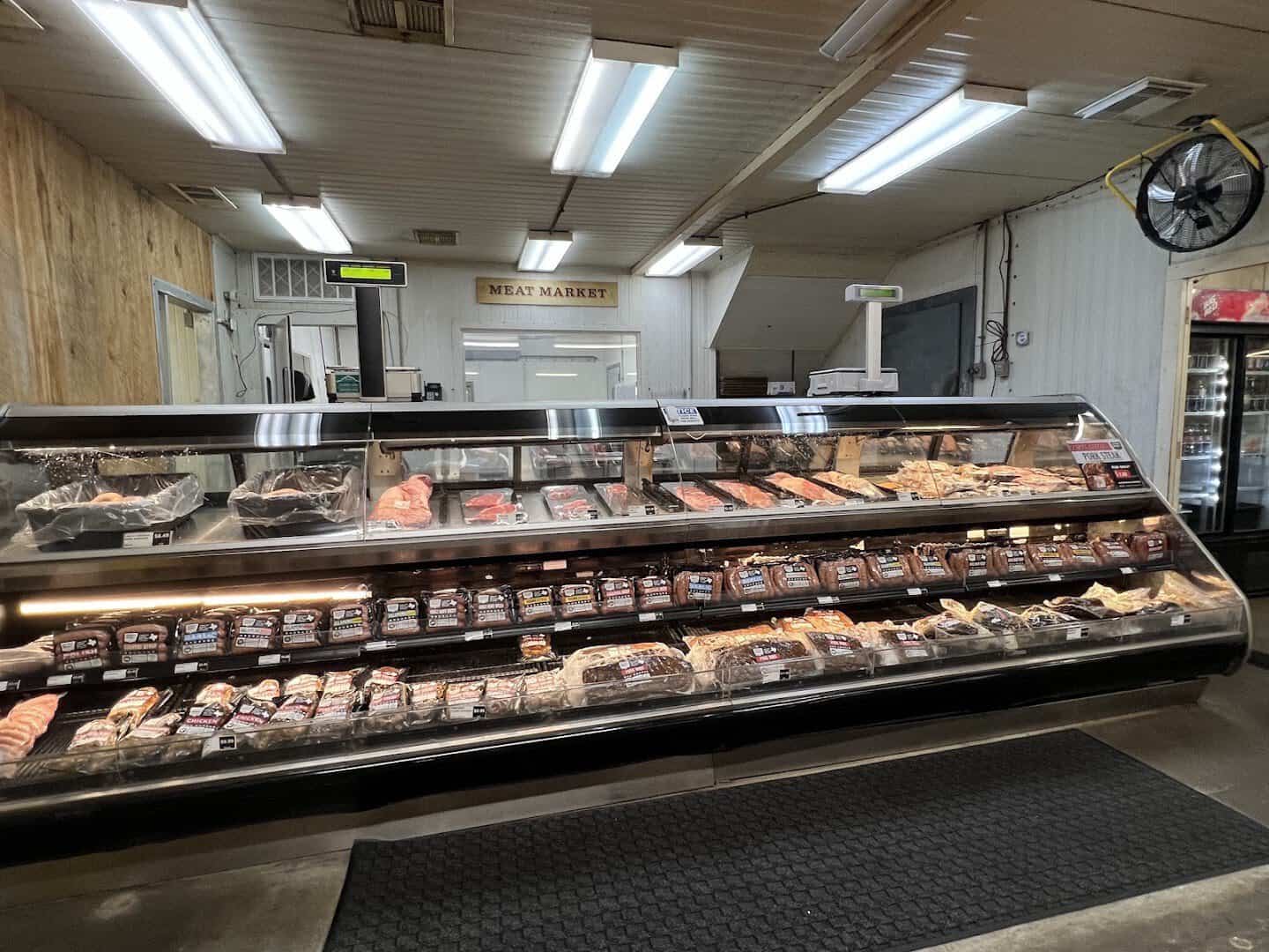 Meat market case full of smoked meats and sausage at Southside Market and Barbeque in Elgin, Texas