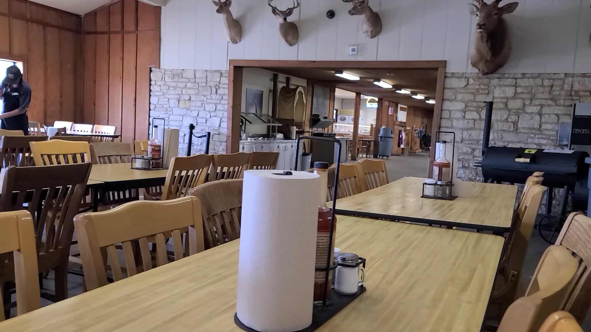 Rustic dining hall with long tables at Southside Market and Barbeque in Elgin, Texas