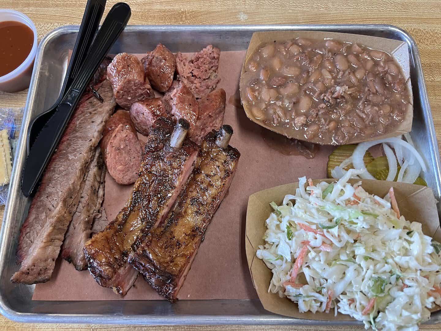 Smoked sausage links and ribs on a tray at Southside Market and Barbeque in Elgin, Texas