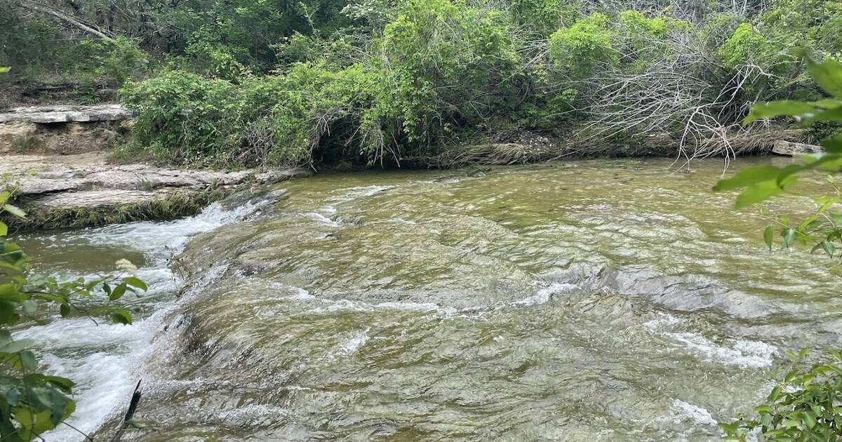 This Hidden Texas Trail Leads to Limestone Waterfalls and Spring Wildflowers