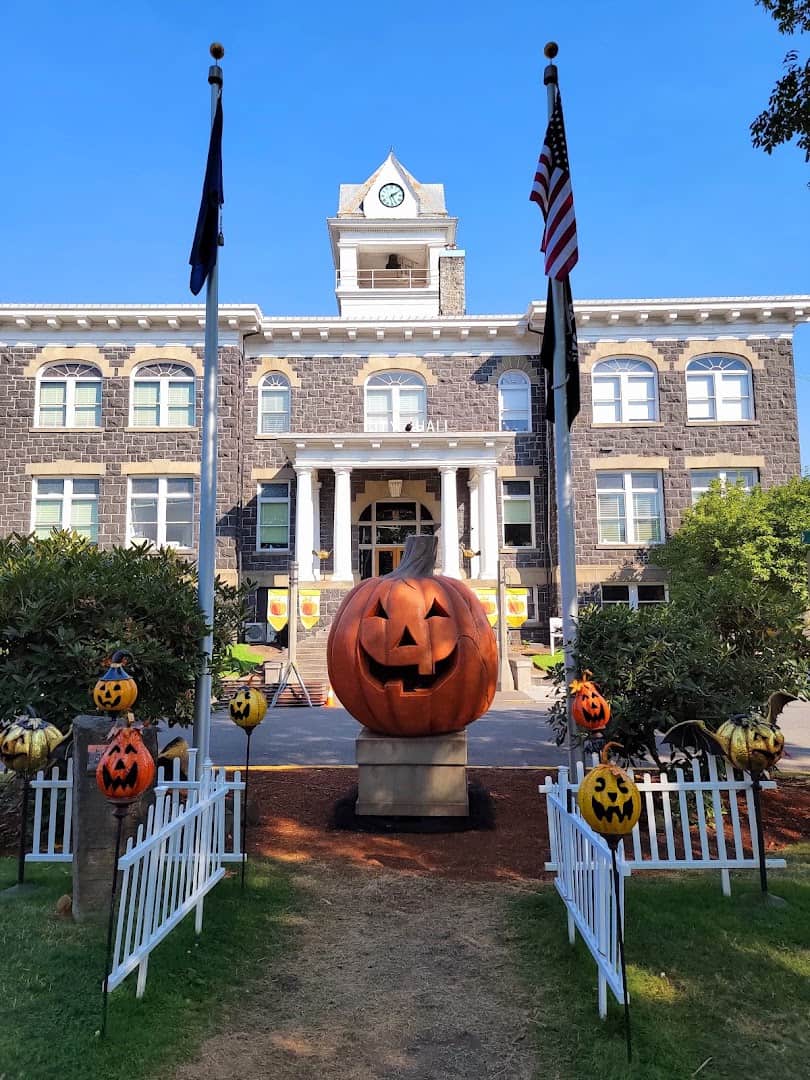 Giant jack-o-lantern and pumpkins outside the courthouse for Spirit of Halloweentown in St. Helens, Oregon