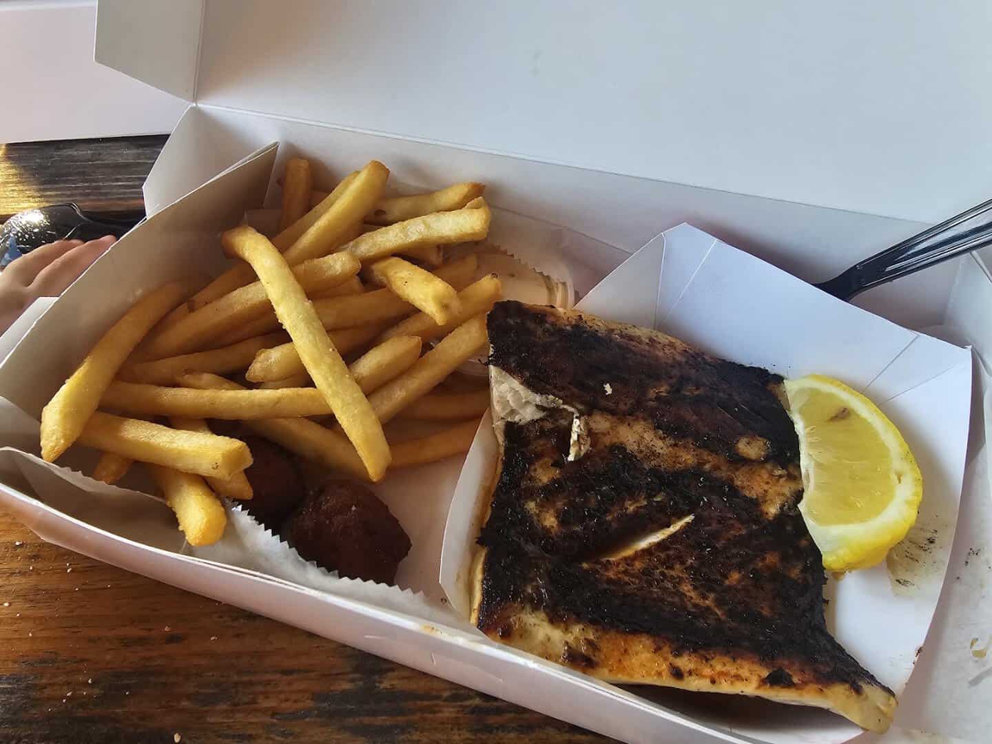 Blackened grouper fillet with fries at Star Fish Company in Cortez, Florida