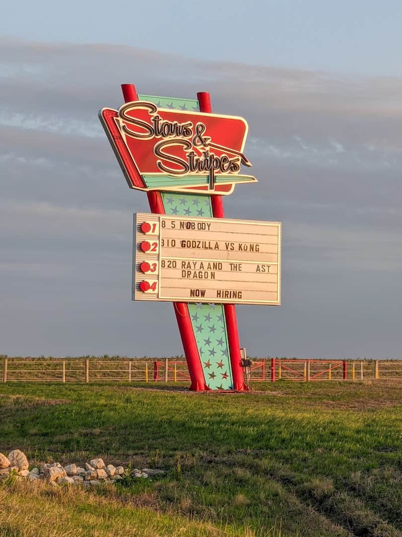 Retro Stars and Stripes drive-in marquee sign with the nights movie lineup