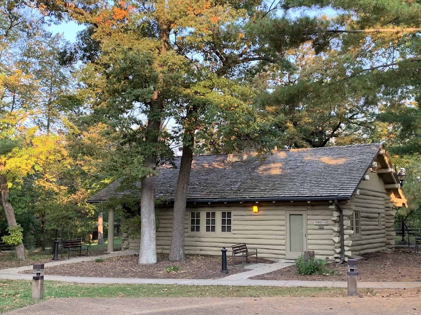 A log cabin among autumn oaks at Starved Rock Lodge, Oglesby, Illinois