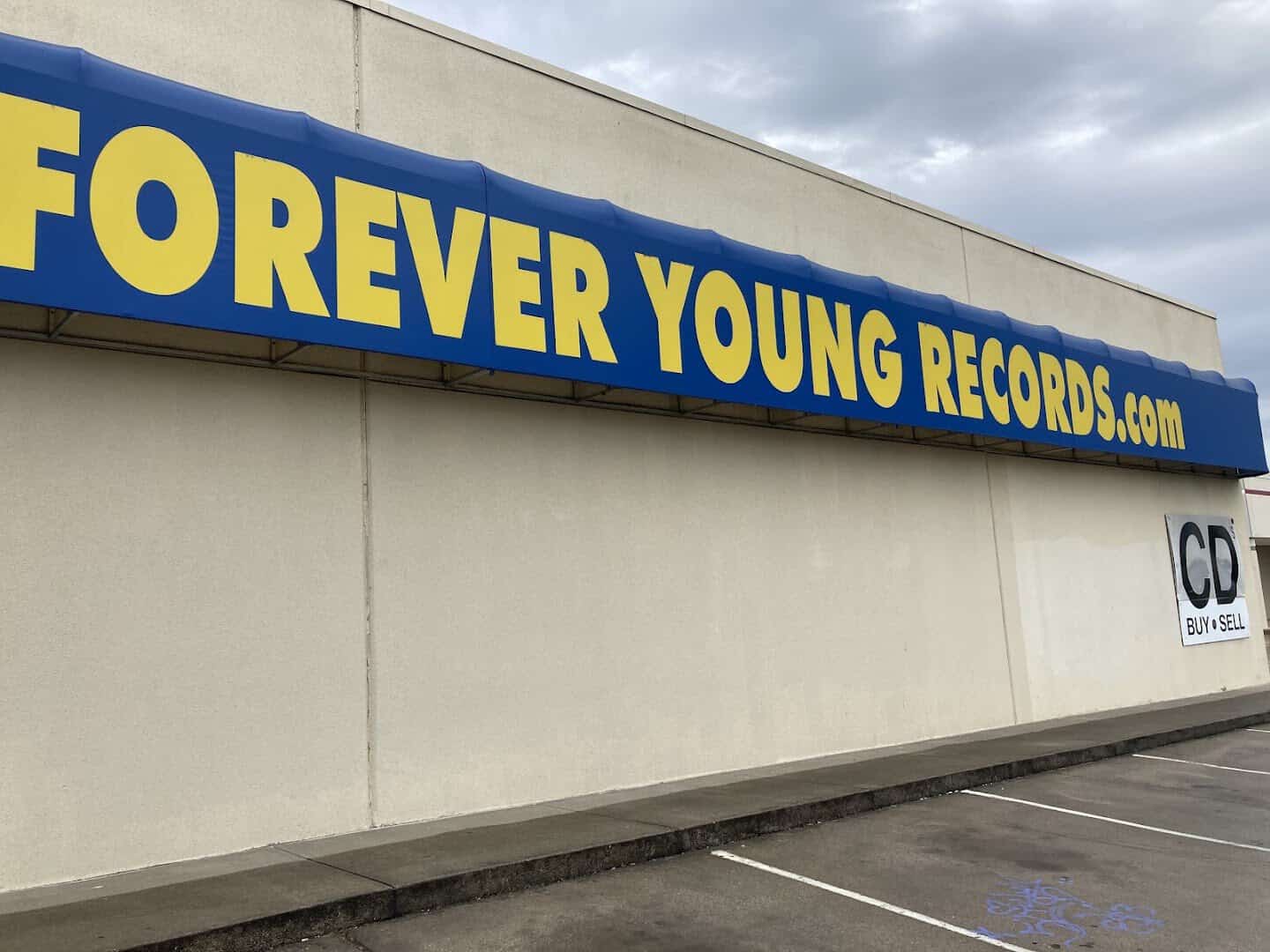 The Forever Young Records storefront sign in Grand Prairie, Texas