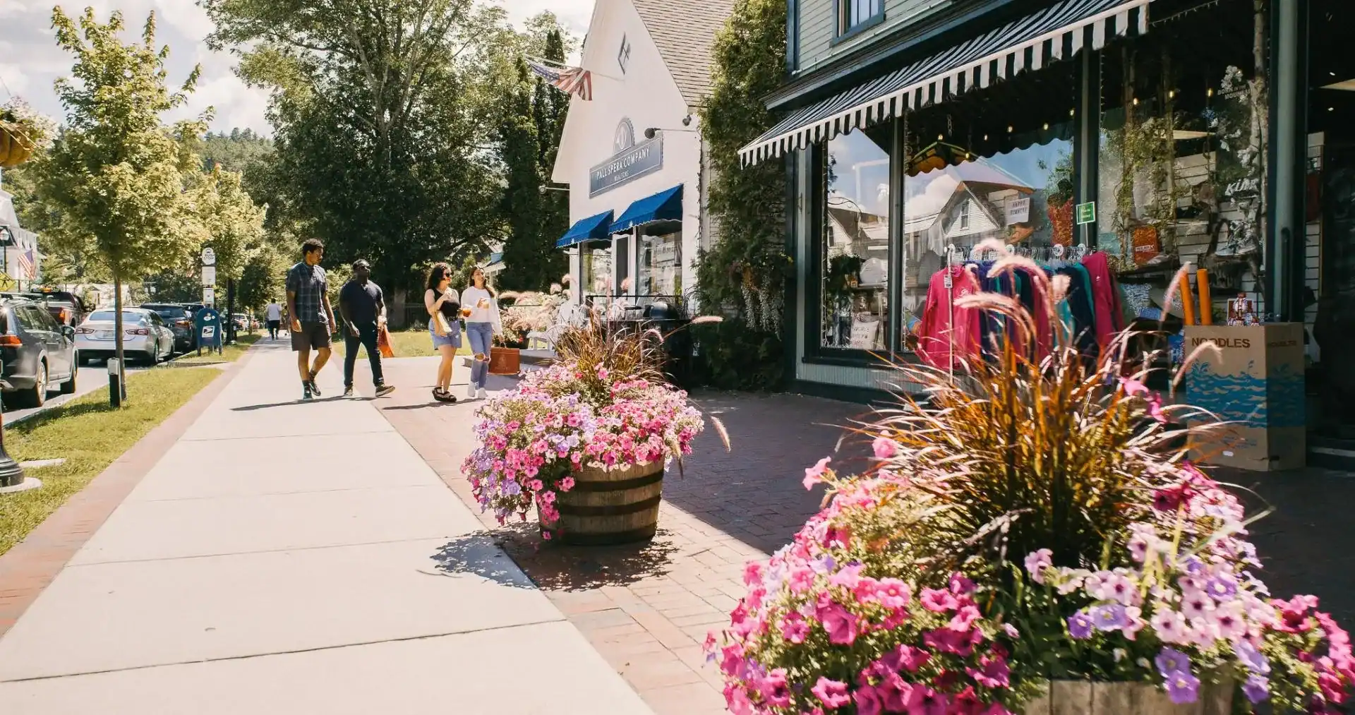 Charming Main Street shops and flower planters in Stowe, Vermont
