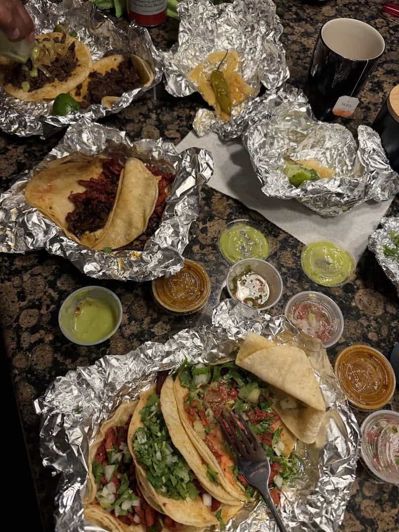 Tacos with green and red salsas at El Taconazo in Houston