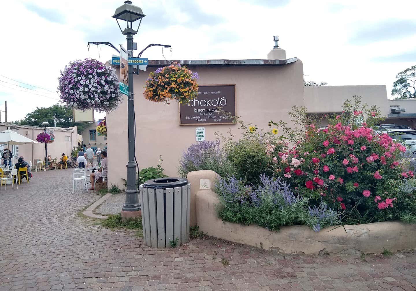 Adobe shop with flower baskets near the plaza in Taos, New Mexico