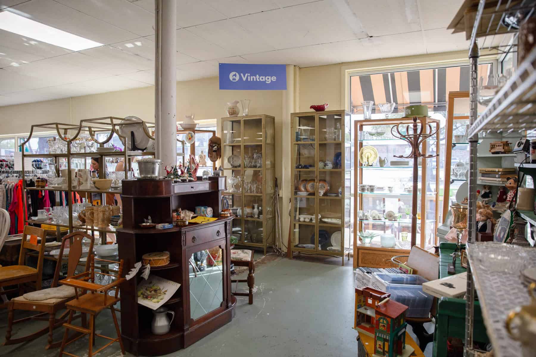 Vintage furniture and home goods inside TEAM Resale Shop in Tomball, Texas