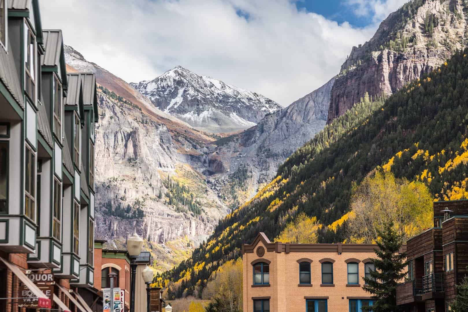 Telluride's main street framed by golden autumn aspens in the San Juan Mountains, Colorado