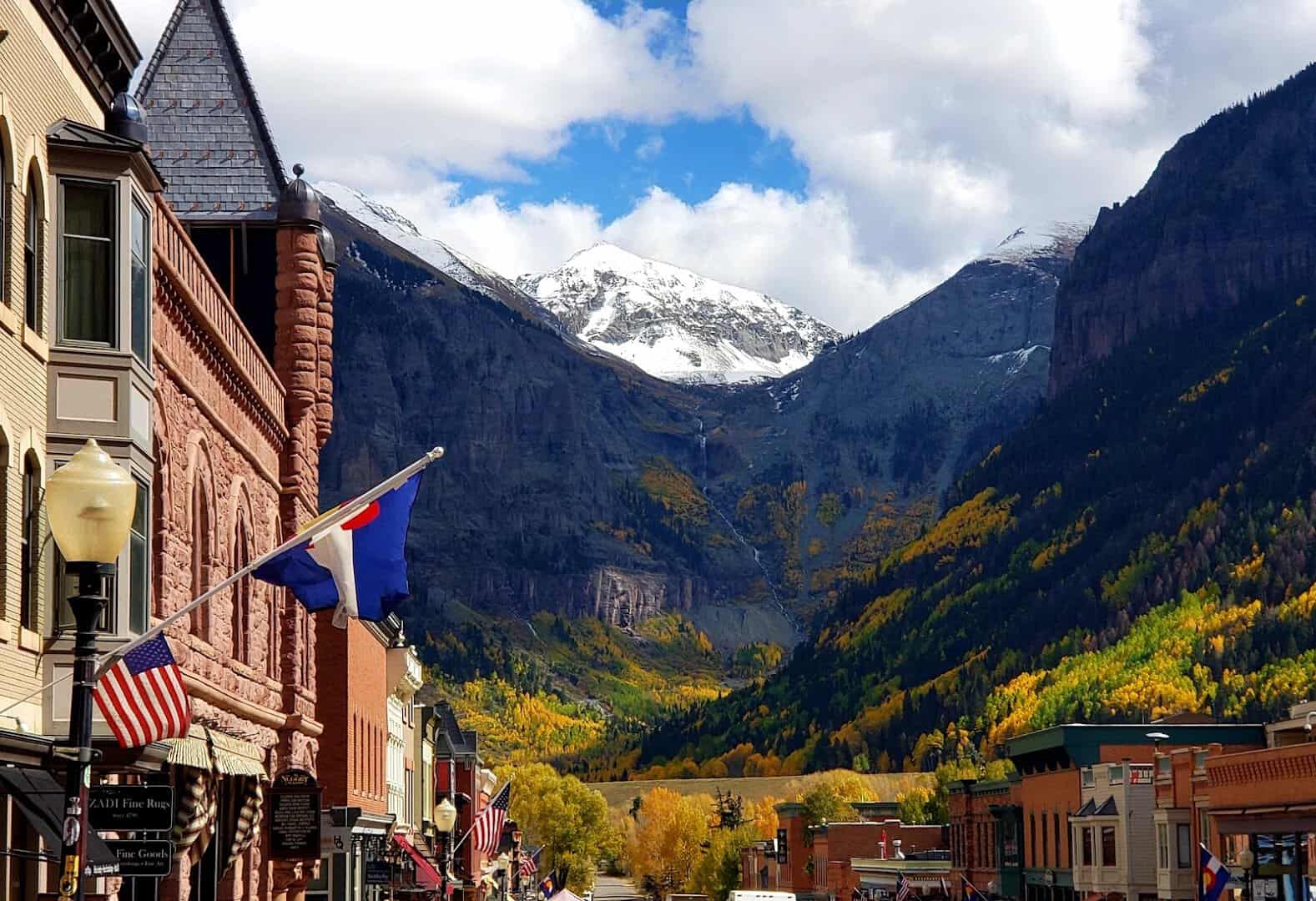 Victorian main street framed by snowcapped mountains in Telluride, Colorado