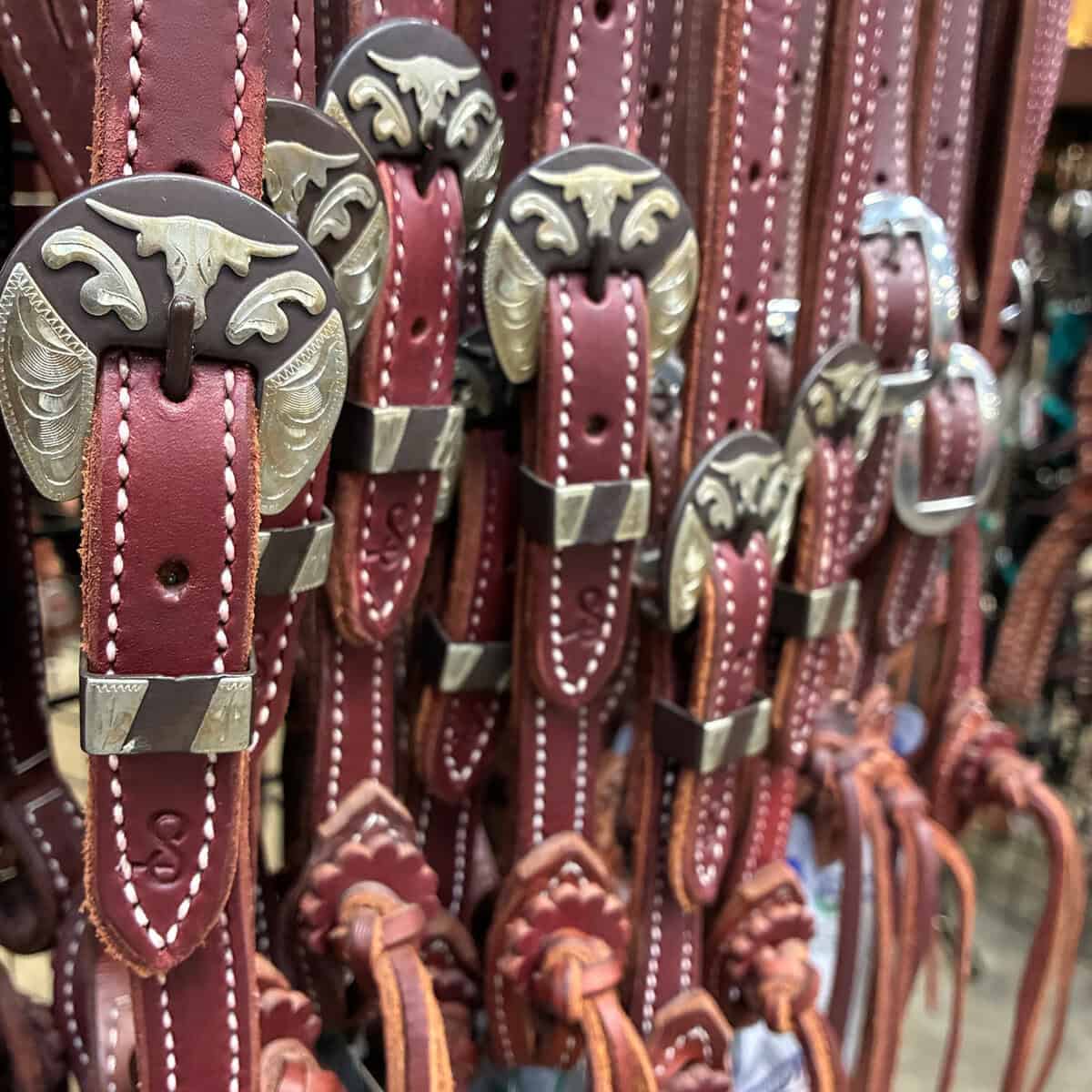 Wall of breast collars and tack at Teskey's Saddle Shop in Weatherford, Texas