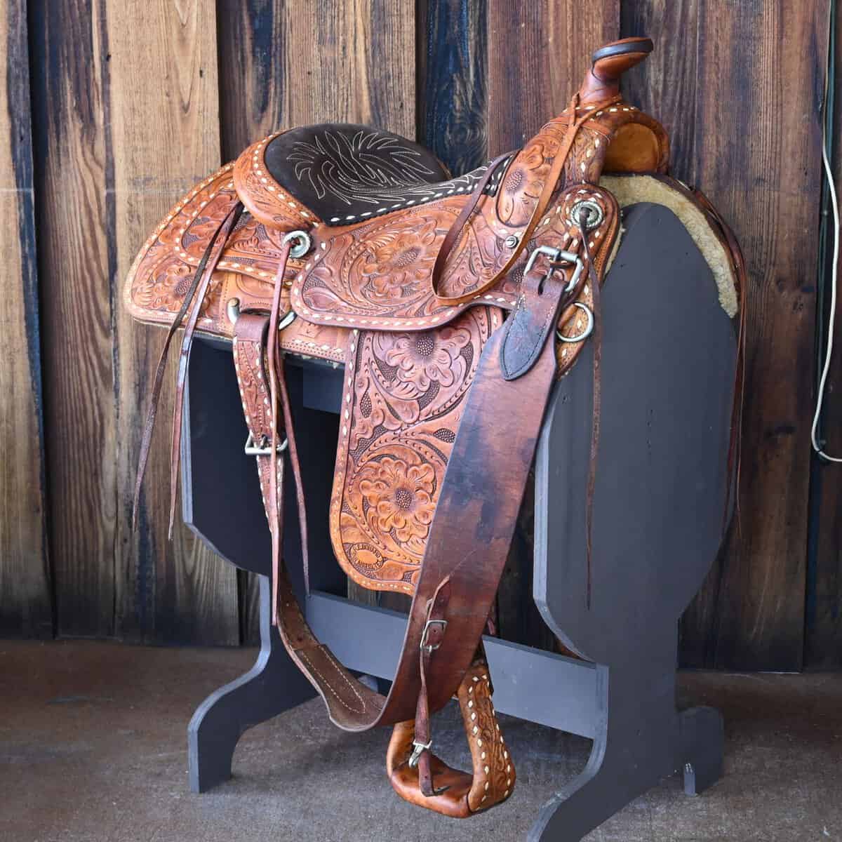 Tooled Western saddle on a stand at Teskey's Saddle Shop in Weatherford, Texas