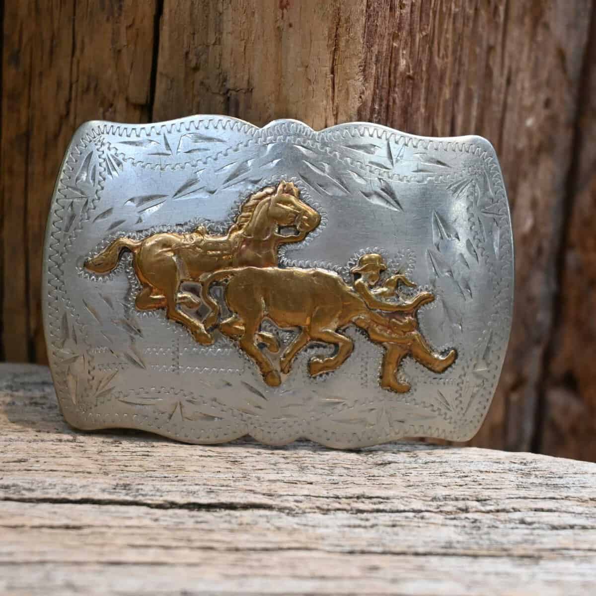 Silver and gold cutting-horse trophy belt buckle at Teskey's Saddle Shop in Weatherford, Texas