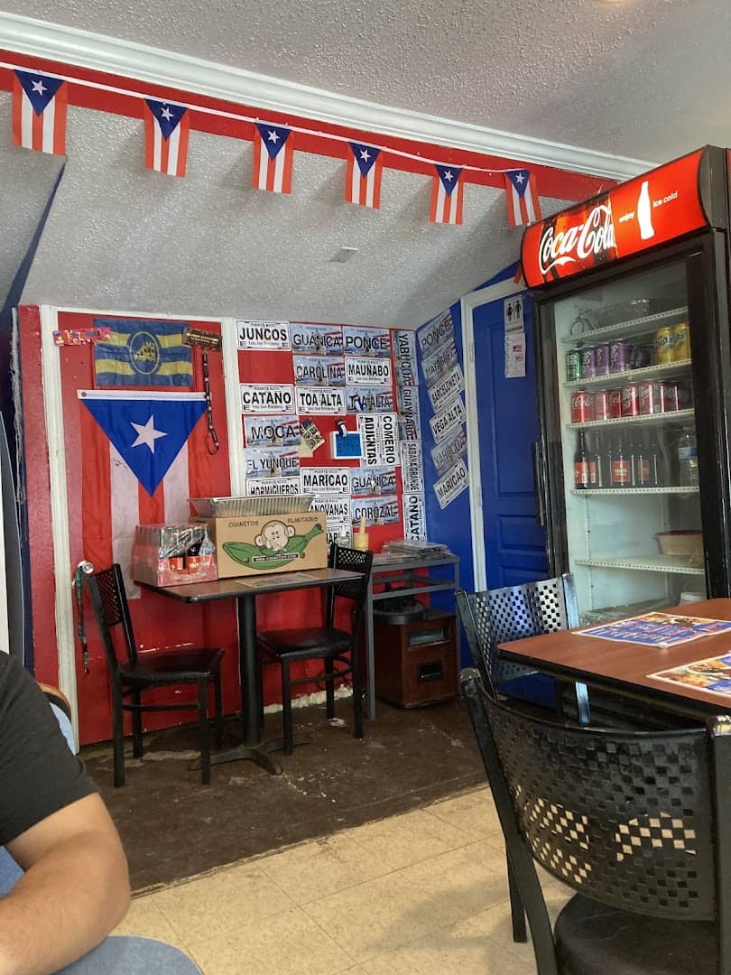 The small dining room with Puerto Rican flag decor at Tex-Chick in Houston
