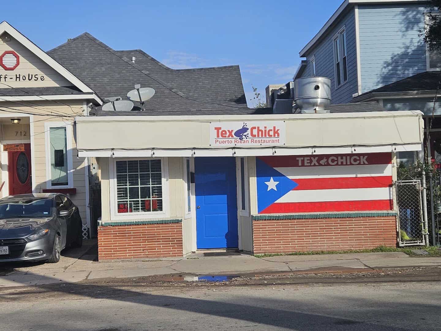 The blue storefront of Tex-Chick Puerto Rican Eatery in Houston