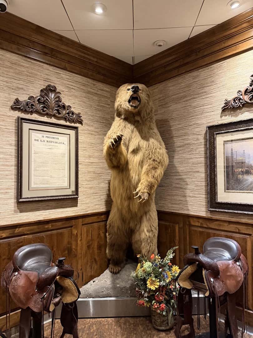 Texas history artifacts and taxidermy on display inside Taste of Texas in Houston