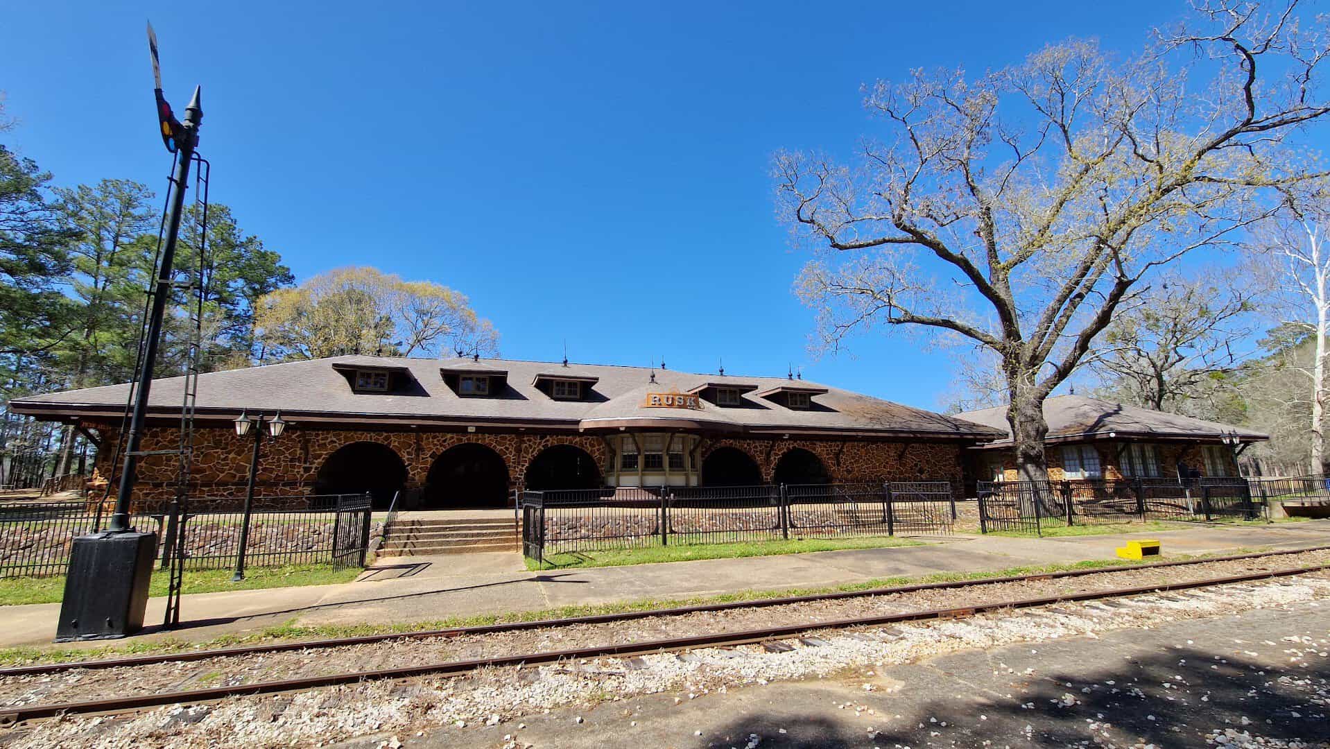 Historic Texas State Railroad depot building among the trees