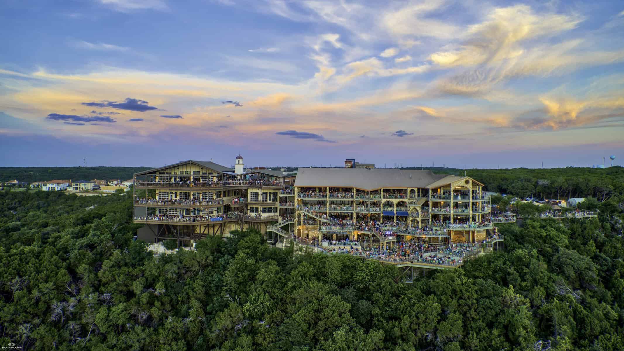 The Oasis restaurant terraces built into the cliff above Lake Travis at dusk