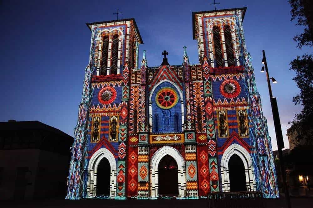Colorful Saga projection lighting up San Fernando Cathedral facade in San Antonio