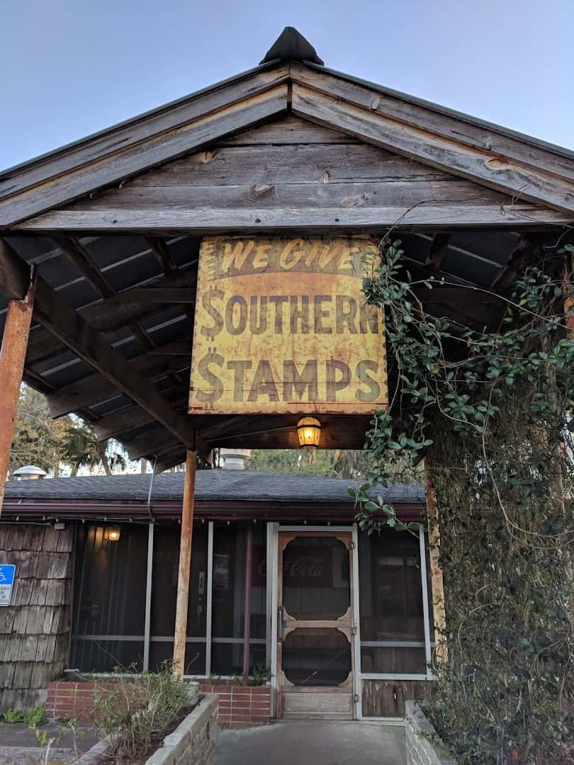 Rustic weathered wood storefront of The Yearling Restaurant in Cross Creek, Florida