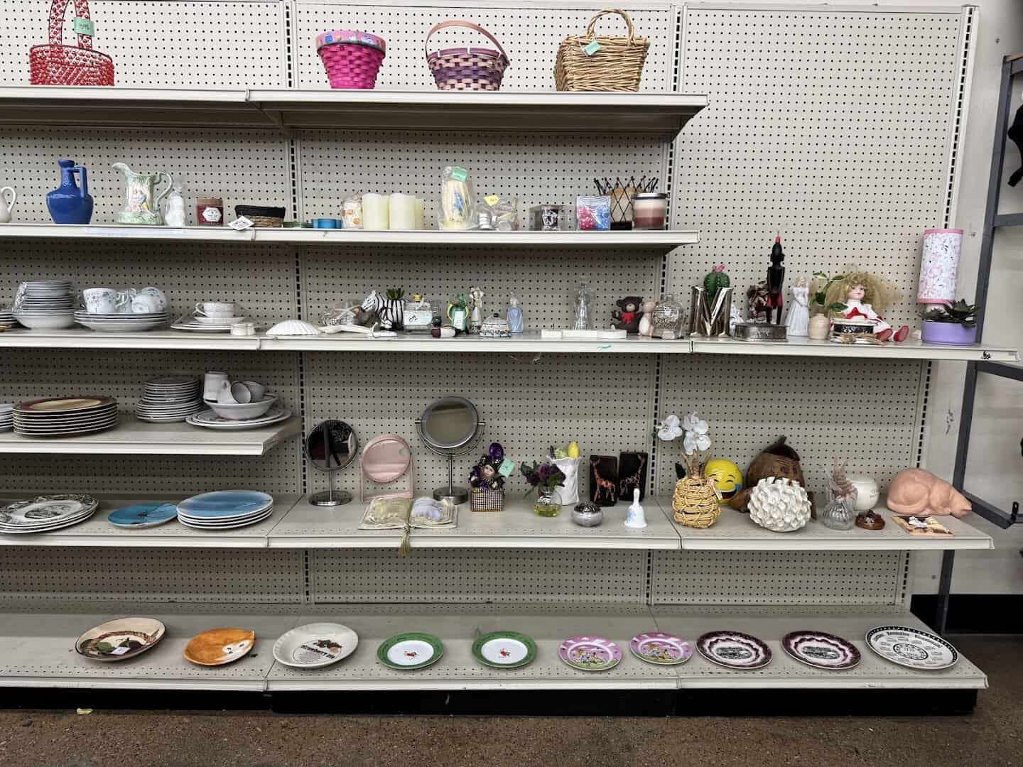 Shelves of glassware, plates and home goods at Thrift Giant in Dallas