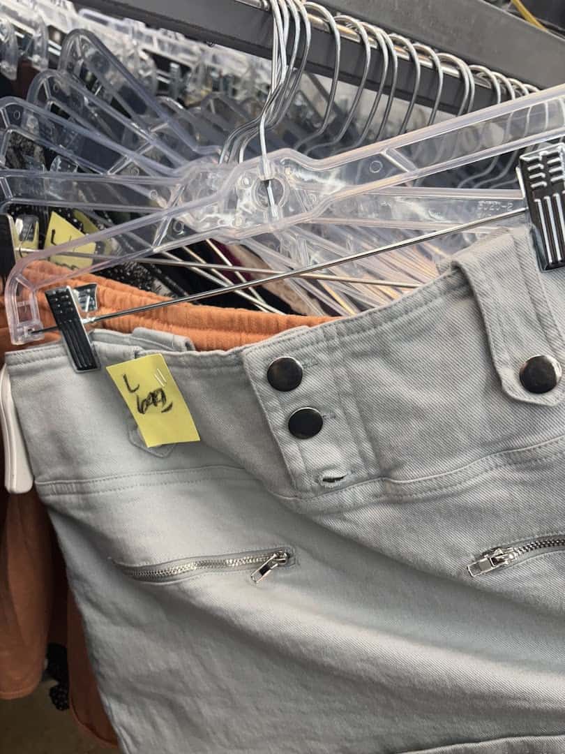 Jeans organized on hangers at Thrift Giant in Dallas
