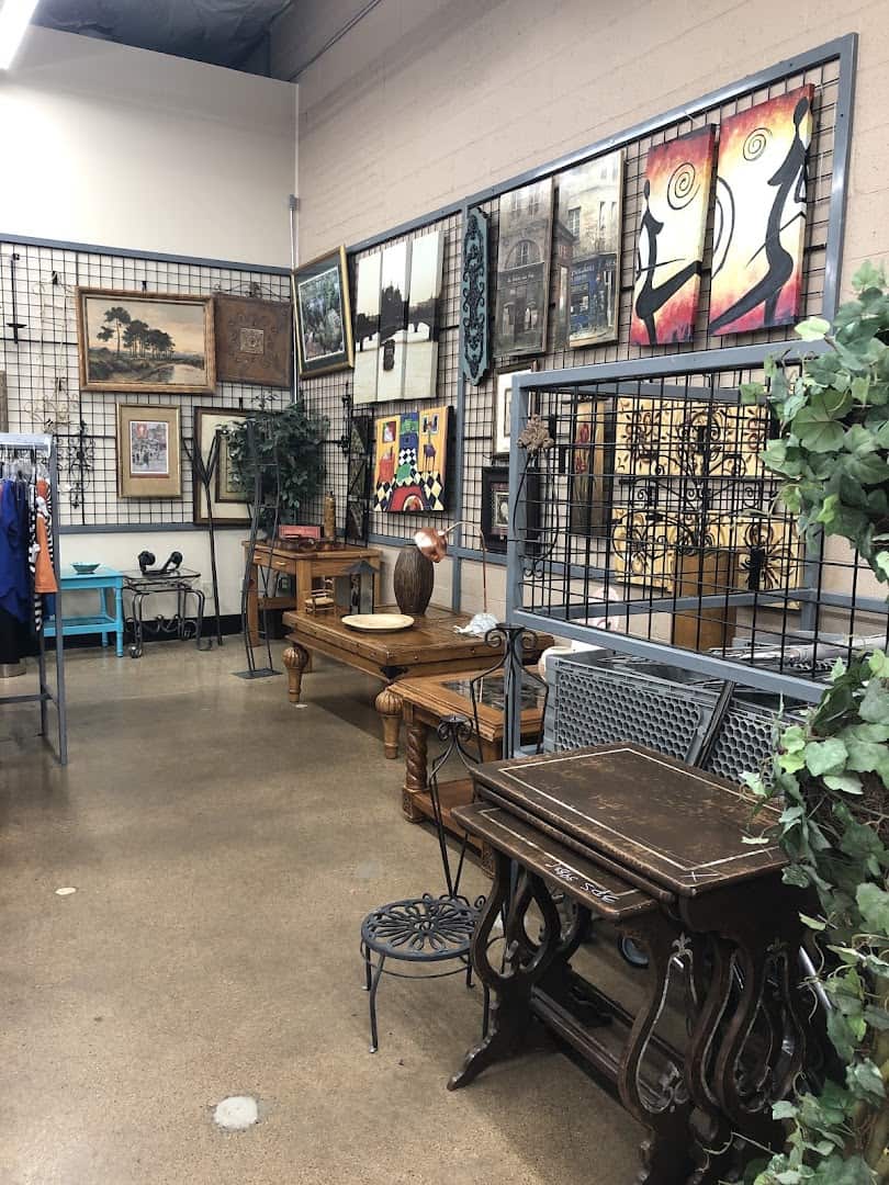 Vintage furniture and framed art corner at Thrift Giant in Dallas