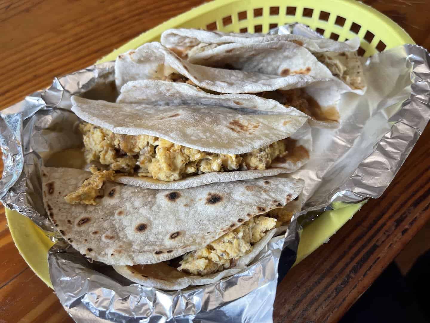 A plate of tacos on fresh tortillas at Titas Taco House in Humble, Texas