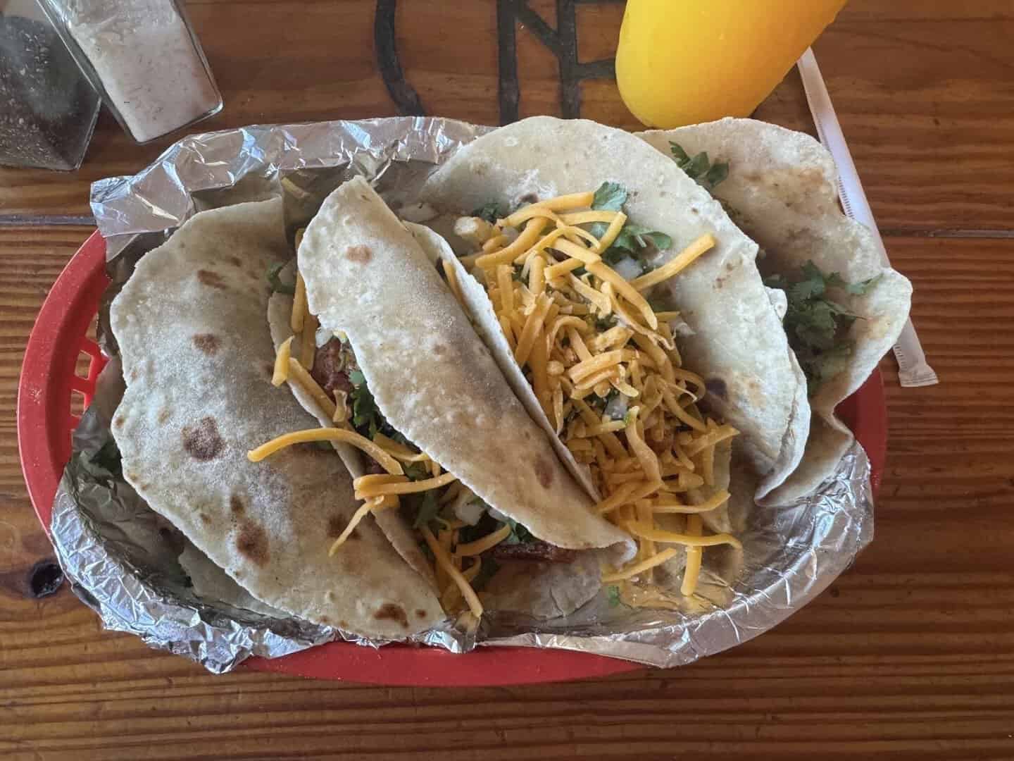 Three tacos on handmade tortillas at Titas Taco House in Humble, Texas