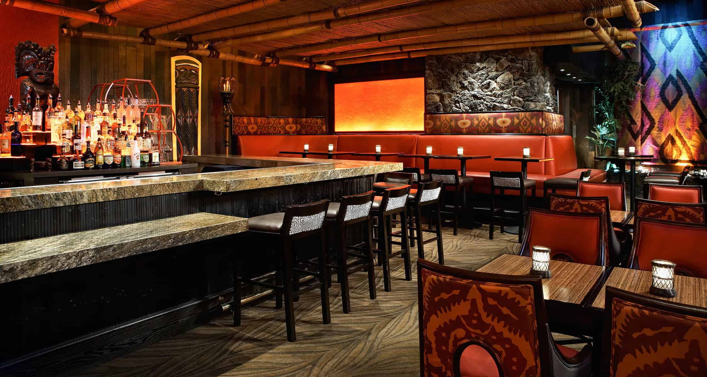 Tiki bar interior with bamboo and carvings at Tonga Room in San Francisco, California