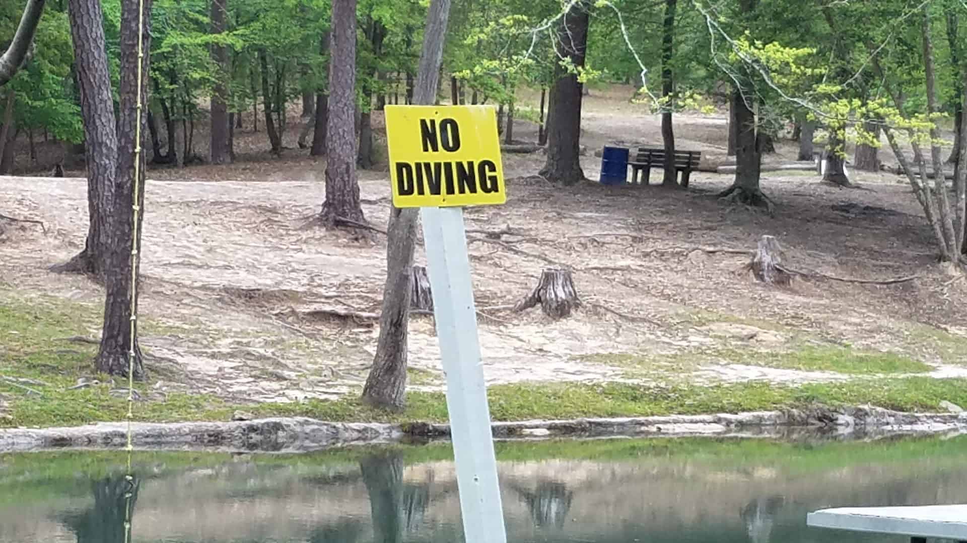 Clear spring water and sandy bank at Camp Tonkawa Springs, Texas