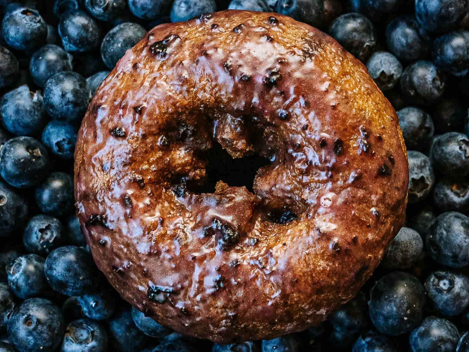 Glazed old-fashioned doughnut on blueberries at Top Pot Doughnuts in Seattle, Washington