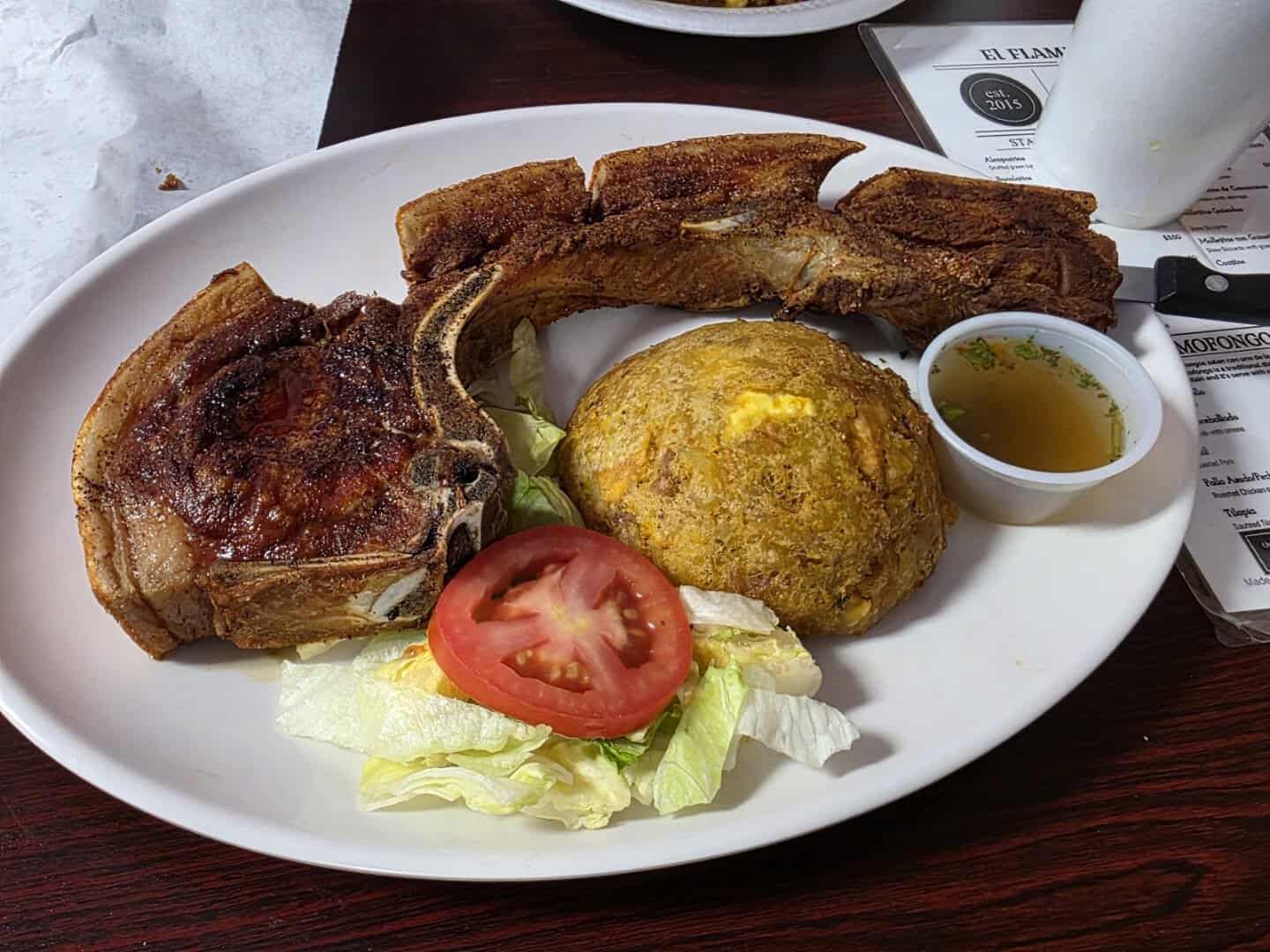 Roasted pork chop with tostones and mofongo at El Flamboyan in Wylie, Texas