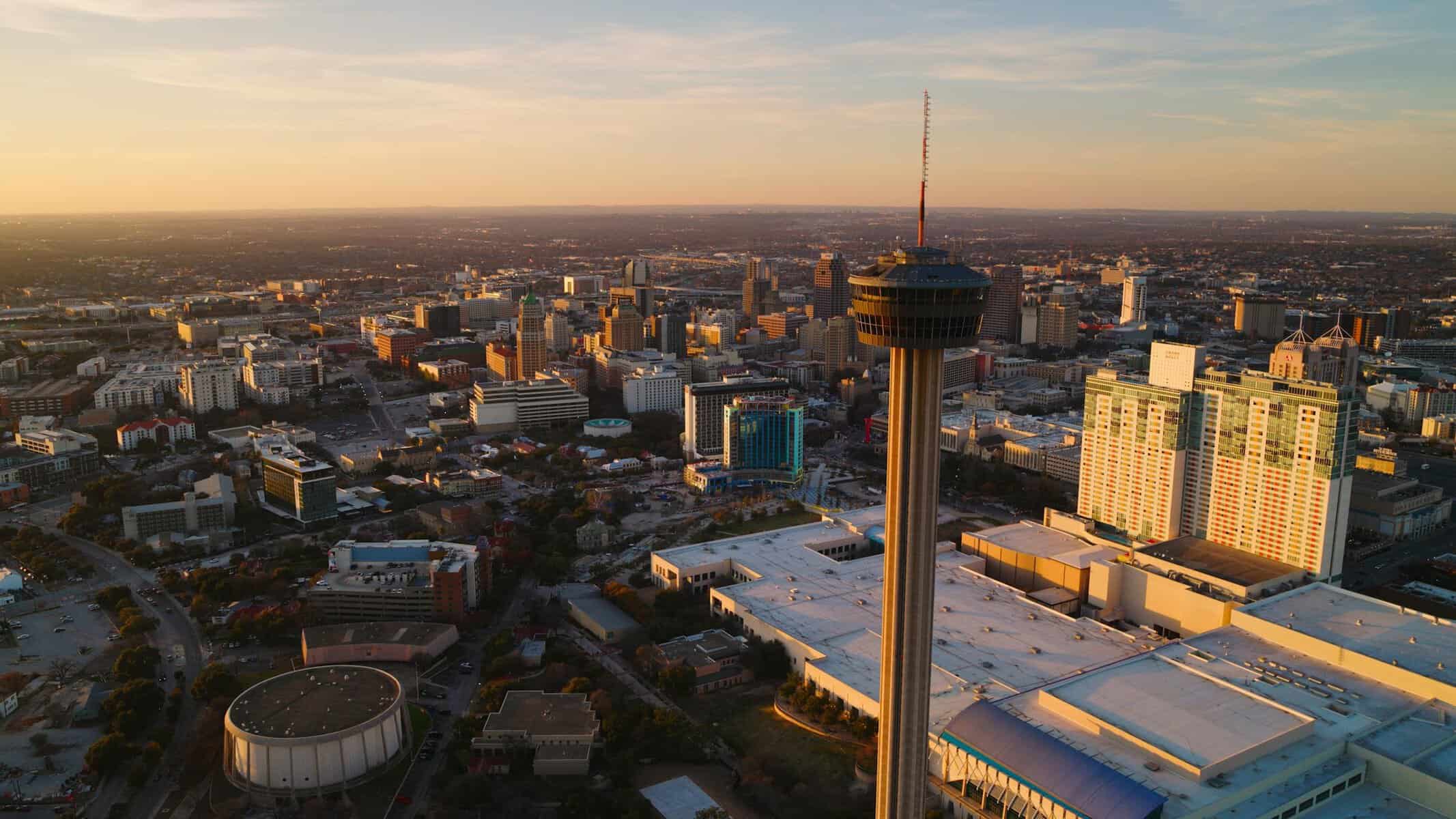 The Tower of the Americas rising over the downtown San Antonio skyline at sunset