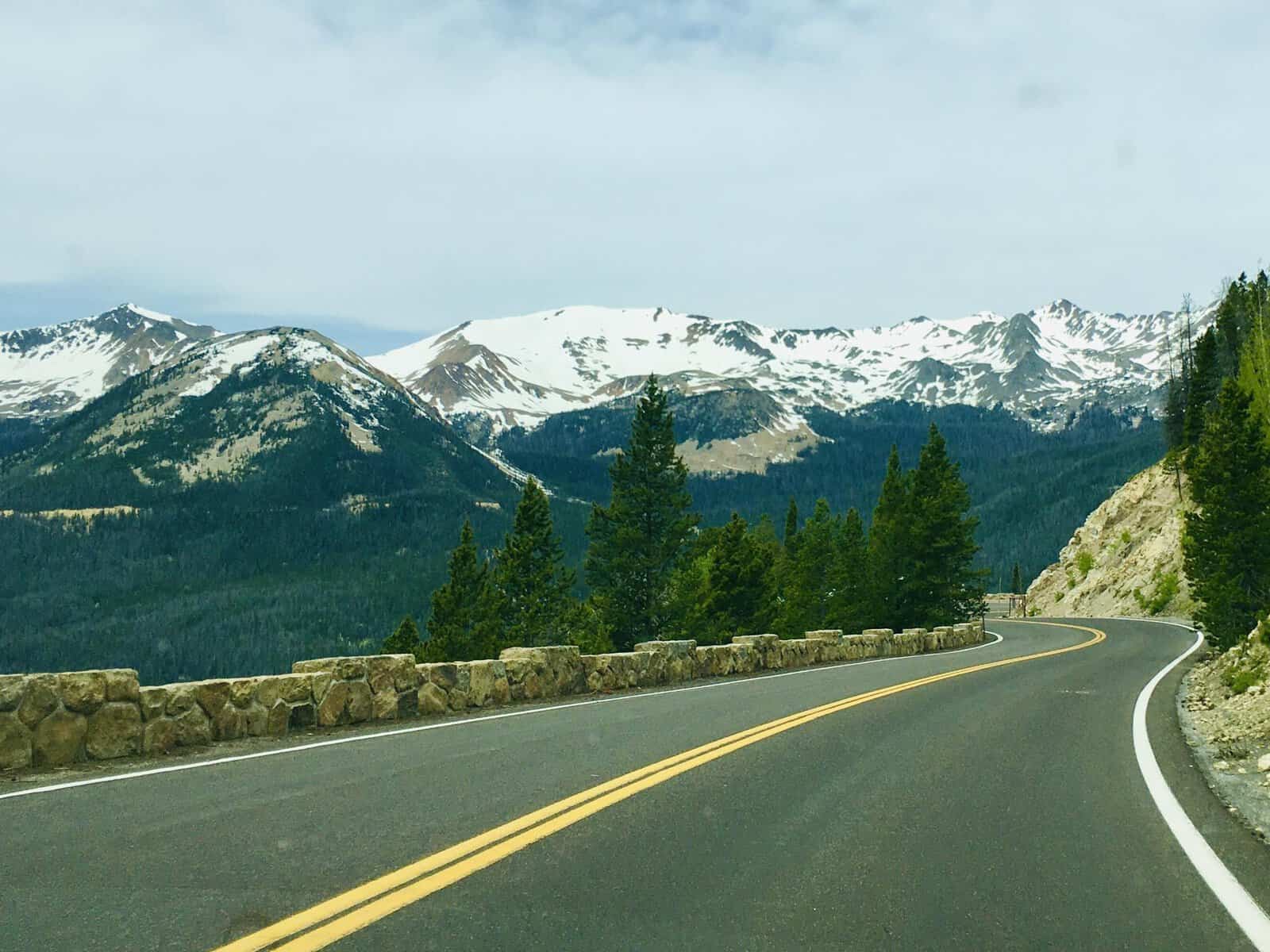 Trail Ridge Road curving toward snow-capped Rocky Mountains, Colorado