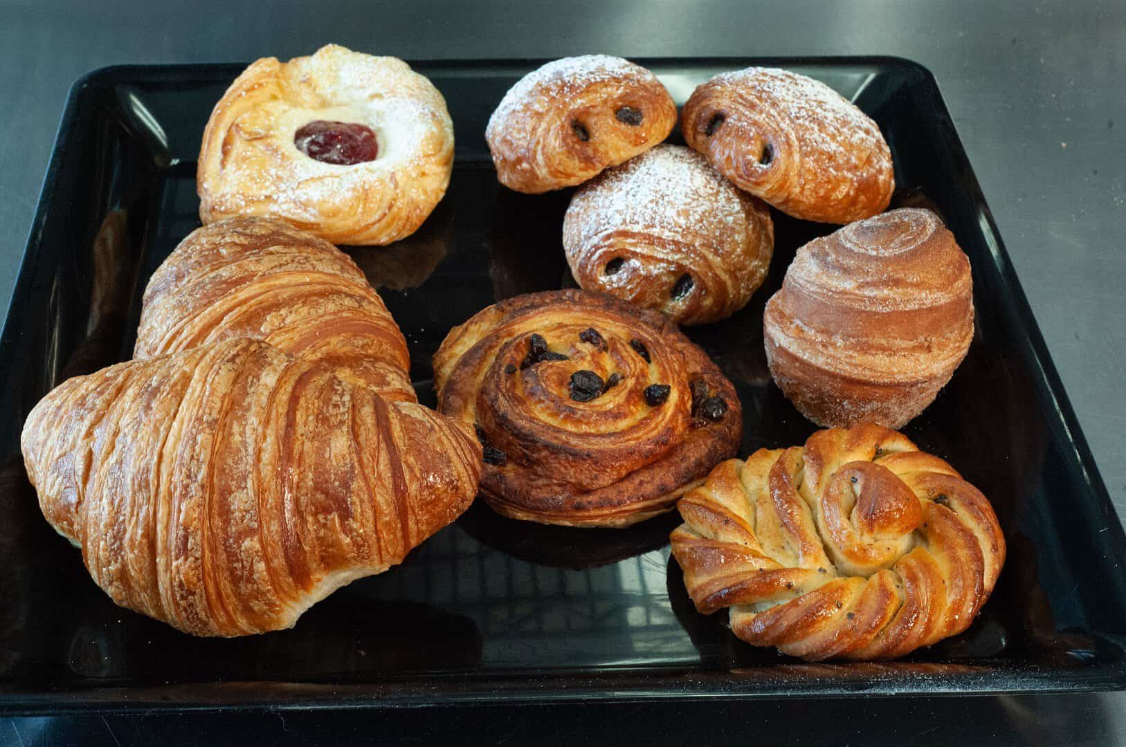 A tray of croissants and pastries at Artisana Bread in Houston, Texas