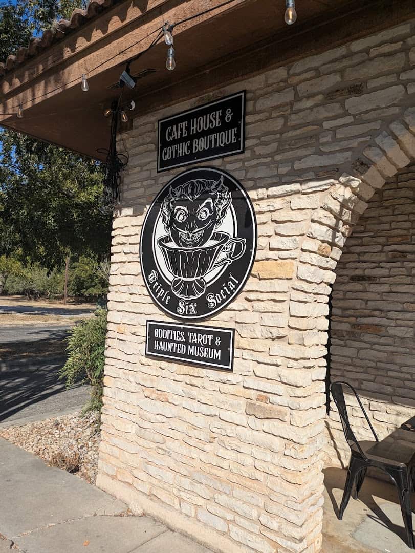 Exterior stone archway entrance of Triple Six Social in San Marcos, Texas