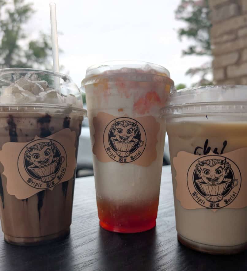 Three Triple Six Social specialty coffee drinks in branded cups